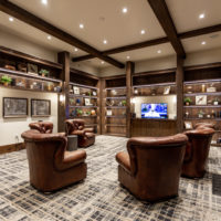 TPC Private Library with leather chairs and tv