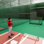 Batter in machine batting cage