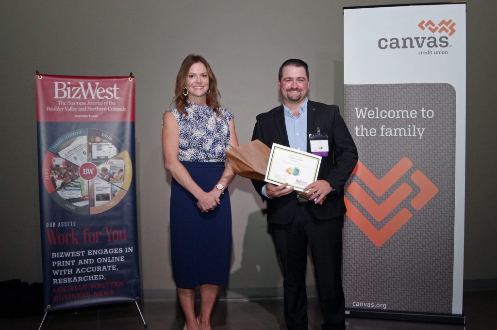 Jordan with 40 Under 40 Award from BizWest