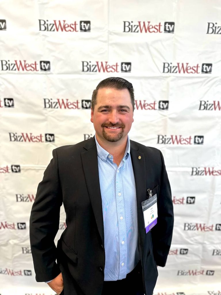 Jordan in front of BizWest step and repear